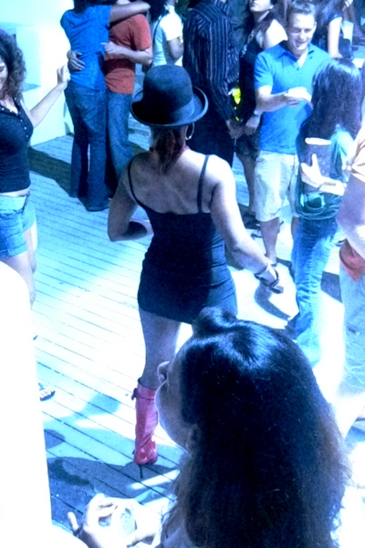 the red boots and red glasses, plus the only female hat I noticed that night